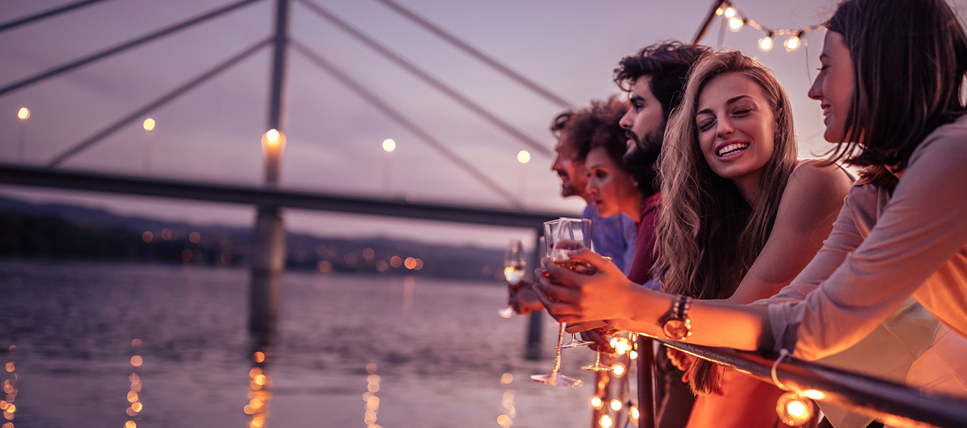 friends enjoying sunset on board